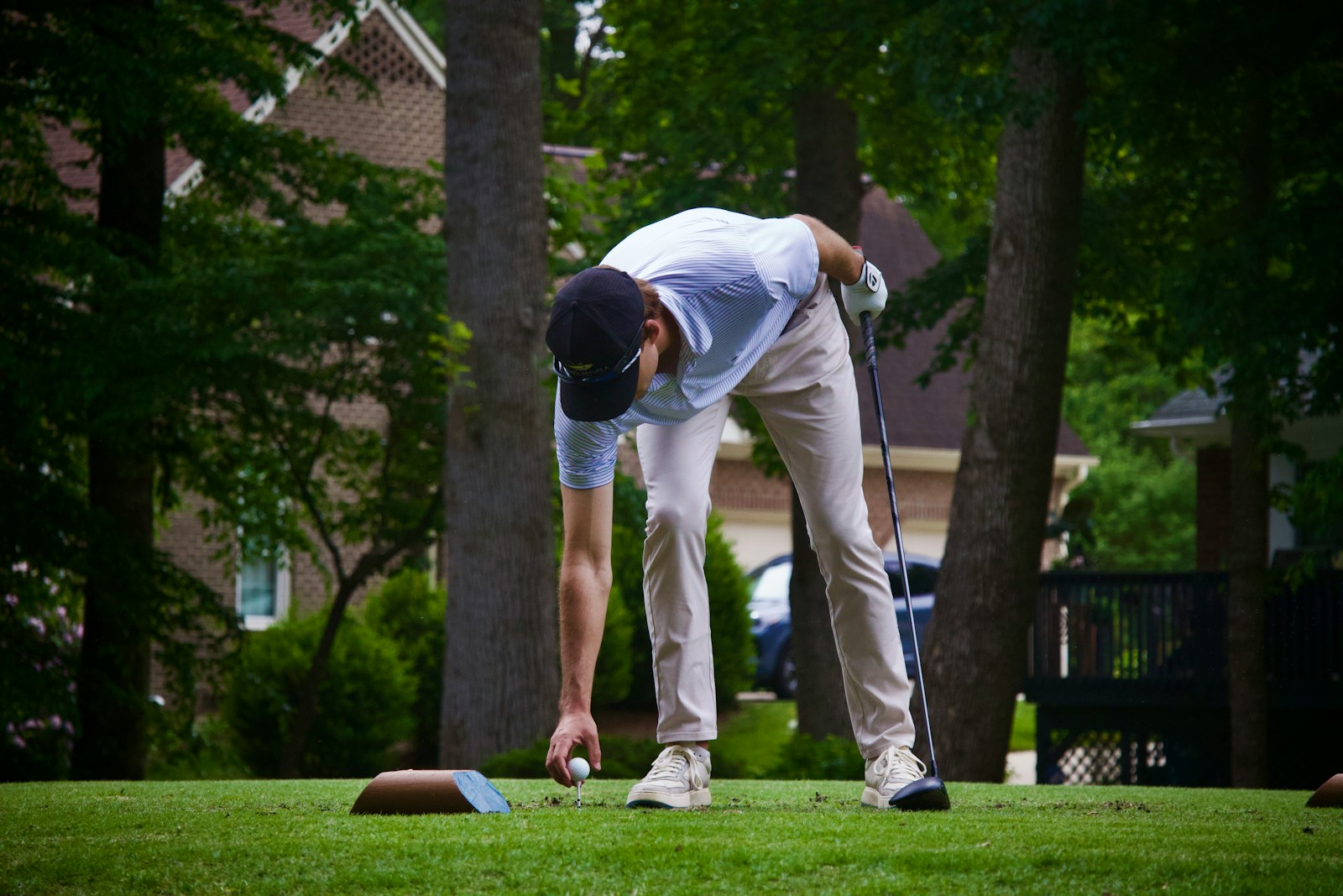 Golfer prepares to tee off on the golf course.